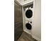 Laundry closet featuring a stacked LG washer and dryer and a grey-painted door at 401 Burton Dr, Alpharetta, GA 30009