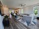 Spacious open-concept living area with hardwood floors, modern decor, and lots of natural light at 401 Burton Dr, Alpharetta, GA 30009