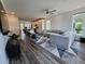 Open concept living room featuring modern decor, recessed lighting, and hardwood floors at 401 Burton Dr, Alpharetta, GA 30009