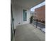 Cozy patio with a sleek railing and view of the neighborhood street at 401 Burton Dr, Alpharetta, GA 30009
