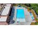 Inviting community pool featuring lounge chairs, umbrellas, and manicured landscaping at 401 Burton Dr, Alpharetta, GA 30009
