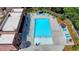 Aerial view of a community pool with lounge chairs and umbrellas ready for residents to enjoy at 401 Burton Dr, Alpharetta, GA 30009