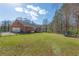 Large, fenced backyard with a well-maintained lawn, ideal for recreation and relaxation at 5826 Little Mountain Dr, Ellenwood, GA 30294