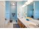 Light bathroom with dual sinks, a large mirror, and bathtub provides a refreshing and functional space at 5826 Little Mountain Dr, Ellenwood, GA 30294