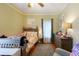 Charming bedroom with a ceiling fan, stylish decor, and a warm, inviting atmosphere at 5826 Little Mountain Dr, Ellenwood, GA 30294