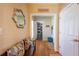 Inviting entryway with hardwood floors, a charming bench, and decorative mirror that creates a warm welcome at 5826 Little Mountain Dr, Ellenwood, GA 30294