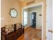 Inviting entryway with hardwood floors, a charming bench, and decorative mirror that creates a warm welcome at 5826 Little Mountain Dr, Ellenwood, GA 30294