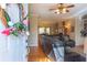 Open doorway view into a living room featuring hardwood floors and inviting decor at 5826 Little Mountain Dr, Ellenwood, GA 30294