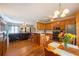 Open-concept living space featuring kitchen, dining, and living areas, with hardwood floors and plenty of natural light at 5826 Little Mountain Dr, Ellenwood, GA 30294