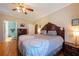 Cozy main bedroom with ceiling fan, hardwood floors, dresser and bedside tables perfect for relaxation at 5826 Little Mountain Dr, Ellenwood, GA 30294