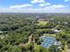 Overhead shot of a lush, green park and athletic fields, with tennis courts and a small pond at 893 Piedmont Ne Ave # 3, Atlanta, GA 30309
