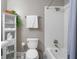Bathroom featuring white tile shower, pedestal sink, and built-in storage at 893 Piedmont Ne Ave # 3, Atlanta, GA 30309