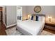 Bedroom with neutral walls, white bed linens, and ensuite bathroom at 893 Piedmont Ne Ave # 3, Atlanta, GA 30309