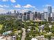 Aerial cityscape view featuring modern buildings, lush greenery and roadways in a desirable area at 893 Piedmont Ne Ave # 3, Atlanta, GA 30309