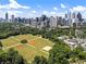 Aerial shot capturing a cityscape with a beautiful green park, trees, and modern buildings at 893 Piedmont Ne Ave # 3, Atlanta, GA 30309