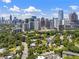 Lovely city view featuring modern high-rise buildings, lush trees, landscaping, and quiet roadways at 893 Piedmont Ne Ave # 3, Atlanta, GA 30309