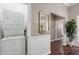 Hallway with stacked washer and dryer and entrance to other rooms at 893 Piedmont Ne Ave # 3, Atlanta, GA 30309