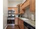 Compact kitchen with stainless steel appliances and granite countertops at 893 Piedmont Ne Ave # 3, Atlanta, GA 30309