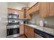 Galley kitchen with stainless steel appliances, light wood cabinets, and granite countertops at 893 Piedmont Ne Ave # 3, Atlanta, GA 30309