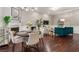 Inviting living space with fireplace, chandelier, and a stylish teal couch at 893 Piedmont Ne Ave # 3, Atlanta, GA 30309
