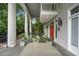 Inviting porch with pillars, seating, and stylish potted plants at 893 Piedmont Ne Ave # 3, Atlanta, GA 30309