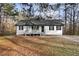 Charming home with a covered porch and a well-maintained yard surrounded by mature trees at 247 Mandy Ct, Mcdonough, GA 30252