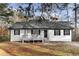 Charming ranch home featuring a covered porch and neatly maintained landscaping at 247 Mandy Ct, Mcdonough, GA 30252