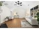 Spacious living room with wood floors, vaulted ceilings, and ample natural light at 247 Mandy Ct, Mcdonough, GA 30252