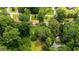 Aerial view of a brown roof house surrounded by green trees, neighborhood streets and houses at 3449 Parkview Dr, Atlanta, GA 30337