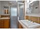 Bathroom featuring double sinks, a tiled shower, and plenty of counter space at 3449 Parkview Dr, Atlanta, GA 30337