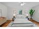 Beautiful bedroom with a full bed, windows with green views, and hardwood floors at 3449 Parkview Dr, Atlanta, GA 30337