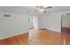 Bright bedroom with hardwood floors, white walls, ceiling fan, and a view of the backyard at 3449 Parkview Dr, Atlanta, GA 30337