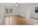 Spacious bedroom with hardwood flooring, two windows offering abundant natural light, and a ceiling fan at 3449 Parkview Dr, Atlanta, GA 30337