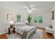 Bright bedroom with a comfortable bed, two bedside lamps, and view to the backyard at 3449 Parkview Dr, Atlanta, GA 30337