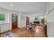 Bright dining area with hardwood floors and a view of the kitchen through french doors at 3449 Parkview Dr, Atlanta, GA 30337