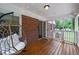 Relaxing screened porch with string lights, a hanging chair, and inviting outdoor space at 3449 Parkview Dr, Atlanta, GA 30337
