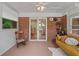 Relaxing sunroom with brick walls, lots of windows, and a comfortable seating area at 3449 Parkview Dr, Atlanta, GA 30337