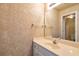 Bathroom featuring decorative wallpaper, vanity with mirror and cabinet, and light fixture at 4095 Boles Creek Dr, Duluth, GA 30096
