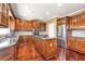 Kitchen boasts custom cabinetry, a center island with a gas cooktop, and stainless steel appliances at 4095 Boles Creek Dr, Duluth, GA 30096