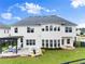 Aerial view showcasing the home's back exterior and outdoor entertaining areas at 4105 Woodwind Dr, Cumming, GA 30028