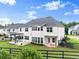 Aerial view of home showcasing the backyard with pergola and well-manicured lawn at 4105 Woodwind Dr, Cumming, GA 30028