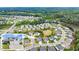 Real estate listing with aerial view of neighborhood and home inset at 4105 Woodwind Dr, Cumming, GA 30028