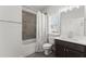 Well-lit bathroom featuring a shower-tub combo, modern vanity, and window at 4105 Woodwind Dr, Cumming, GA 30028