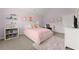 Inviting bedroom features plush carpet, pink accents, and natural light at 4105 Woodwind Dr, Cumming, GA 30028