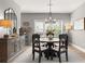 Comfortable dining area features a round table, black chairs, and stylish decor throughout the space at 4105 Woodwind Dr, Cumming, GA 30028