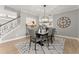 Dining room showcasing contemporary decor, a modern chandelier, and an open floor plan layout at 4105 Woodwind Dr, Cumming, GA 30028