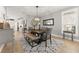 Elegant dining room features contemporary furnishings and decor with large windows at 4105 Woodwind Dr, Cumming, GA 30028