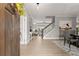 Open foyer showcasing hardwood floors, a staircase, and views into the dining and living spaces at 4105 Woodwind Dr, Cumming, GA 30028