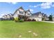 Well-maintained lawn and landscaping complement this charming two-story home at 4105 Woodwind Dr, Cumming, GA 30028