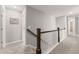 Hallway featuring wood and white staircase at 4105 Woodwind Dr, Cumming, GA 30028